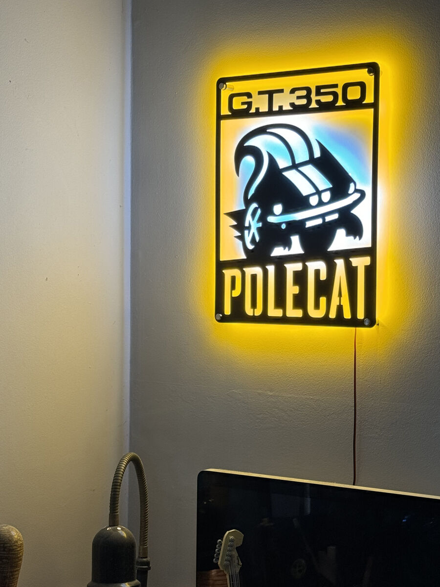 Polecat LED sign — mounted on wall