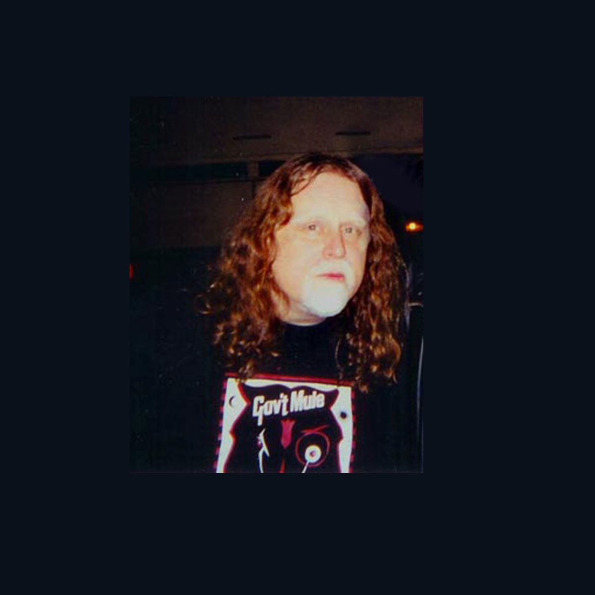 Warren Haynes with the Tri Horse mark